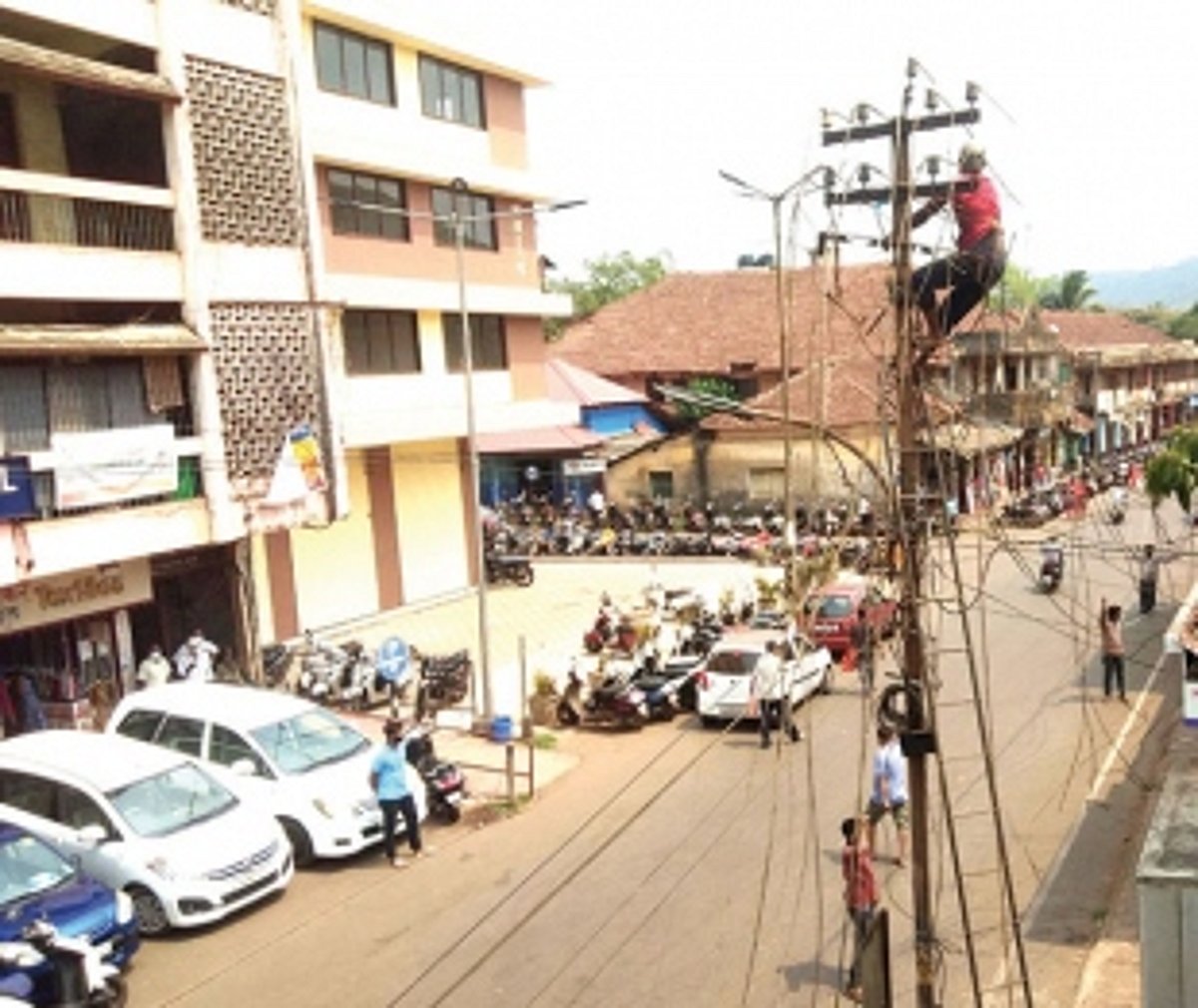 Power Dept removes overhead  wires from Curchorem market