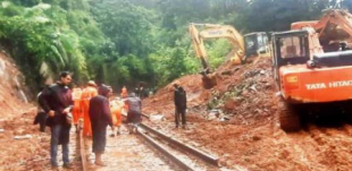 Railway personnel restore track  after landslips near Dudhsagar