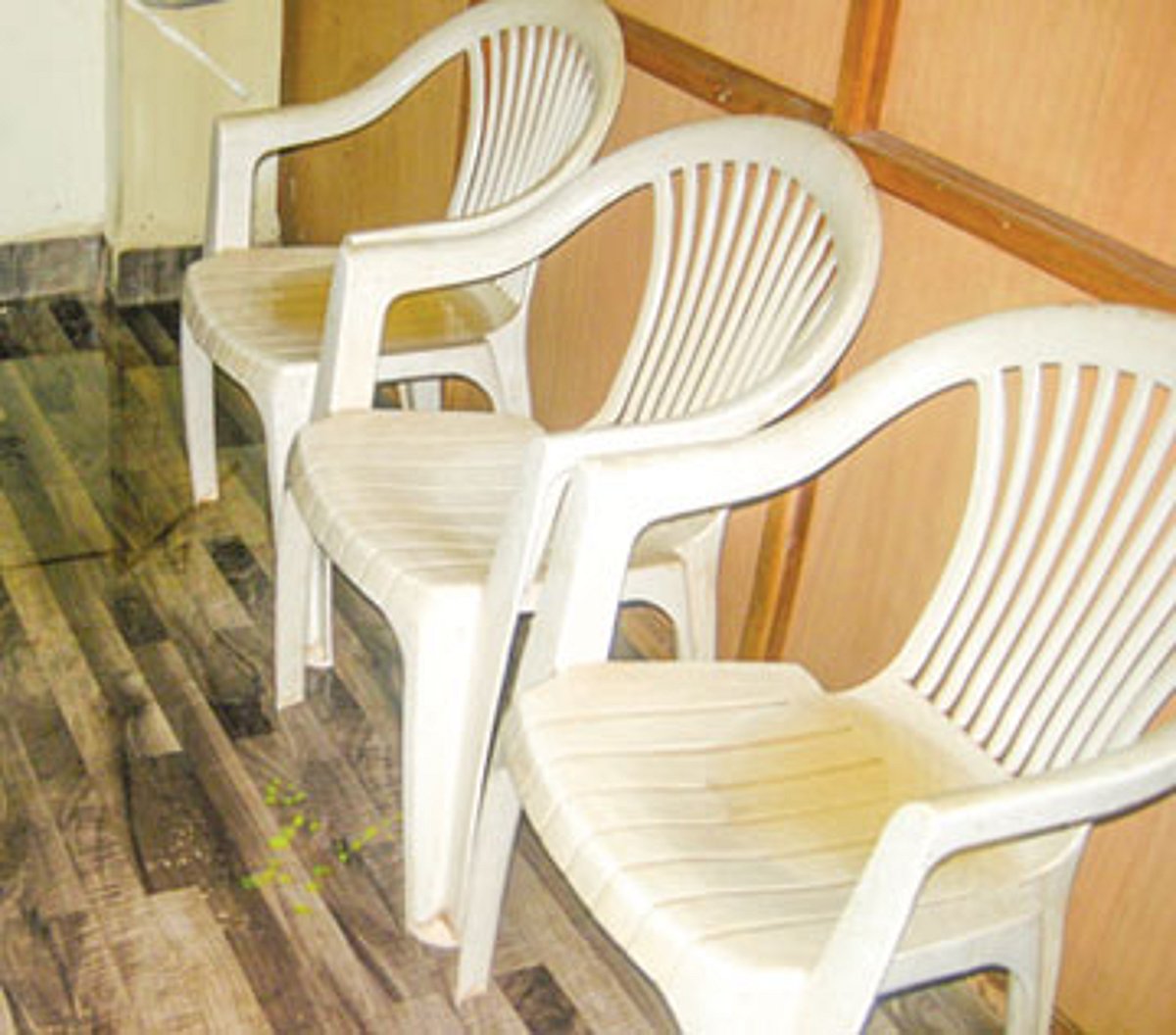 Rain water accumulated on chairs inside the South Goa Zilla Panchayat office.