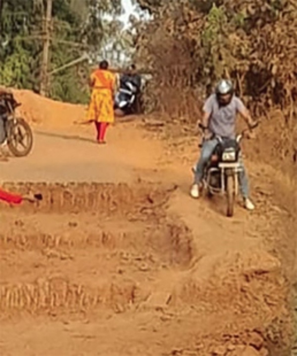 Reckless bikers take risky  shortcut through closed road