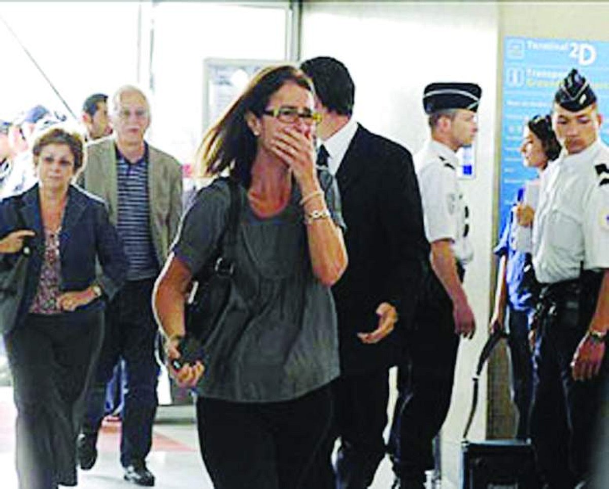 Relatives of passengers arrive at the crisis center on Monday at the Charles-de-Gaulle airport in Roissy, northern suburb of Paris.