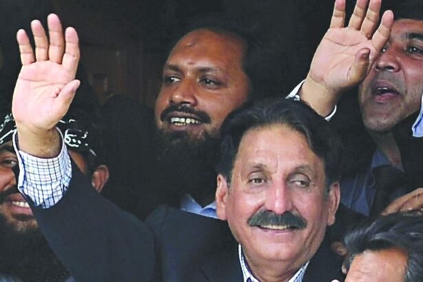 Restored Pakistani Supreme Court Chief Justice Iftikhar Muhammad Chaudhry gestures among colleagues and other lawyers at his residence in Islamabad.