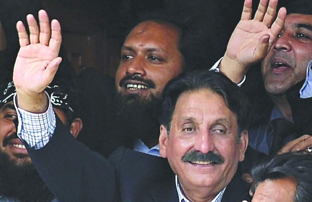Restored Pakistani Supreme Court Chief Justice Iftikhar Muhammad Chaudhry gestures among colleagues and other lawyers at his residence in Islamabad.