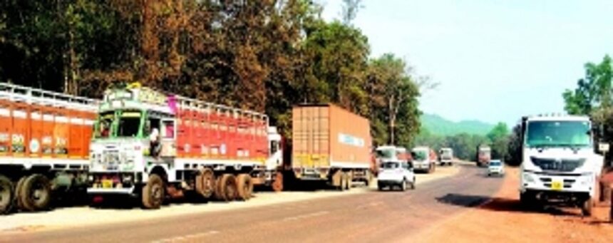 Risky commute in Bythakol: Parked trucks, low-hanging power lines pose threat