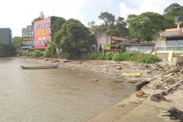 Rubbish piles along ferry  wharfs in Mandovi River