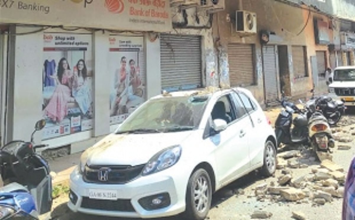 Rubble from crumbling building in market area comes crashing down