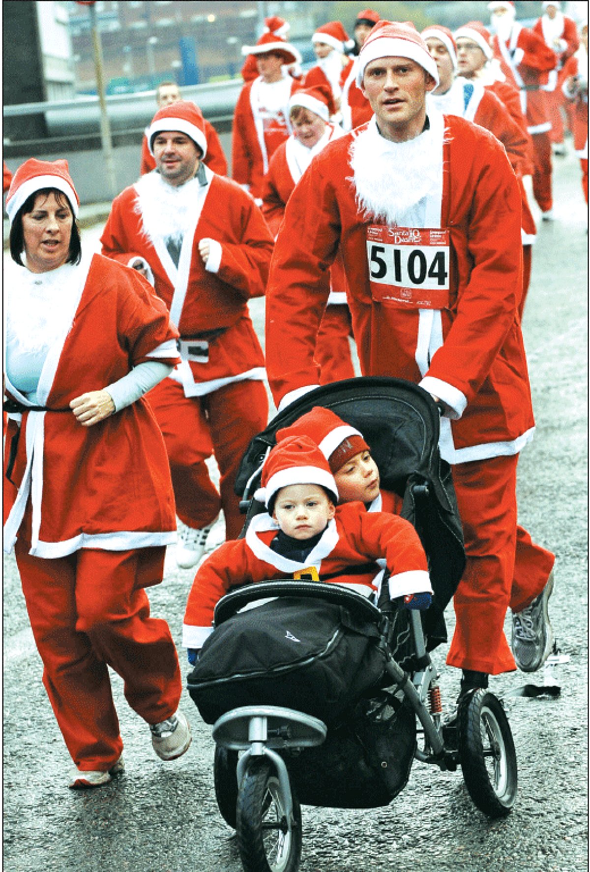 Runners dressed as Santa Claus take part in the 2010 Santa Dash in Liverpool, north-west England. The annual race saw thousands of competitors run the 5km course through the streets of the city centre.