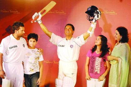 Sachin Tendulkar, along with his son Arjun, daughter Sara and wife Anjali, poses with his waxwork figure at the unveiling ceremony in Mumbai on Monday.
