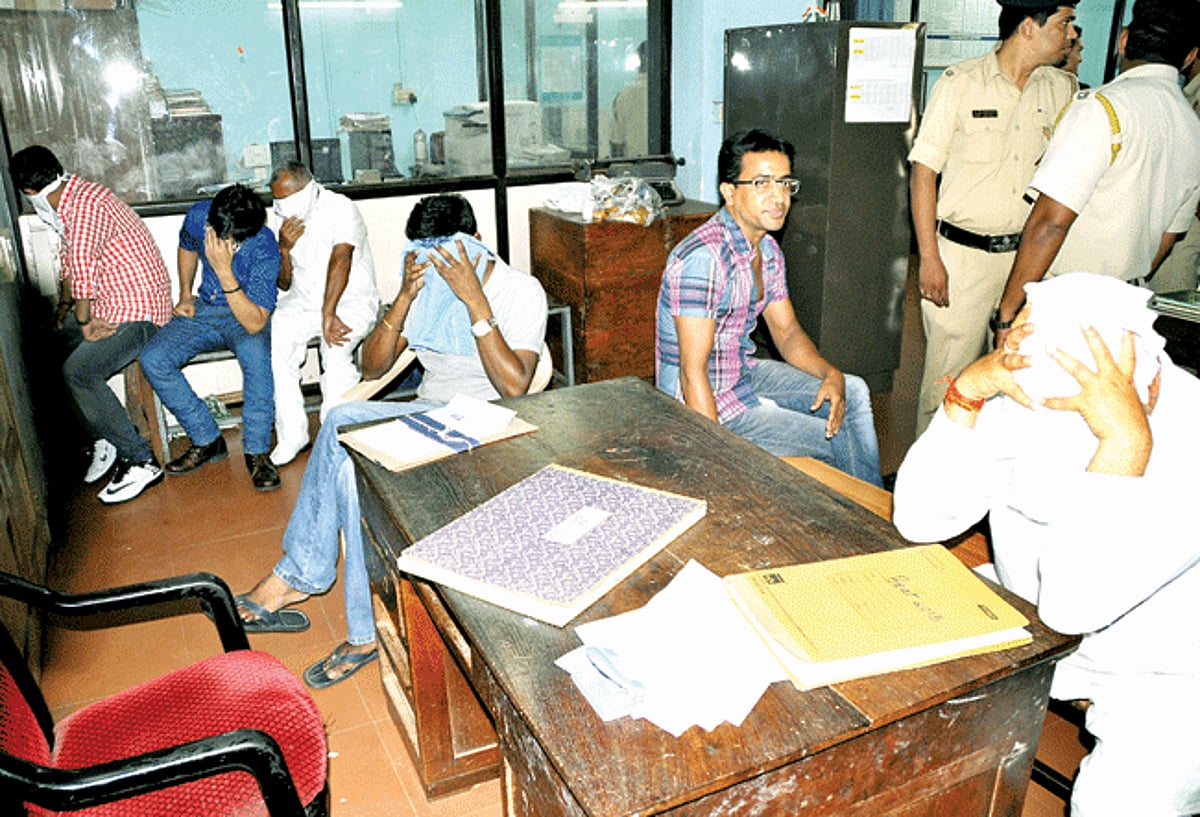 Samajwadi Party MLA from Uttar Pradesh, Mahendra Kumar Singh (right), along with other associates arrested by Goa Police, during a raid on a dance bar in a hotel at Campal, Panjim on Tuesday.