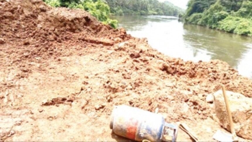 Sanvordem locals urge railways to clear mud dumped into river