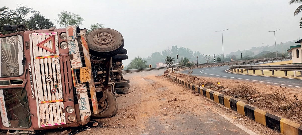 Scanner on road alignment as truck flips over at Dhavalim