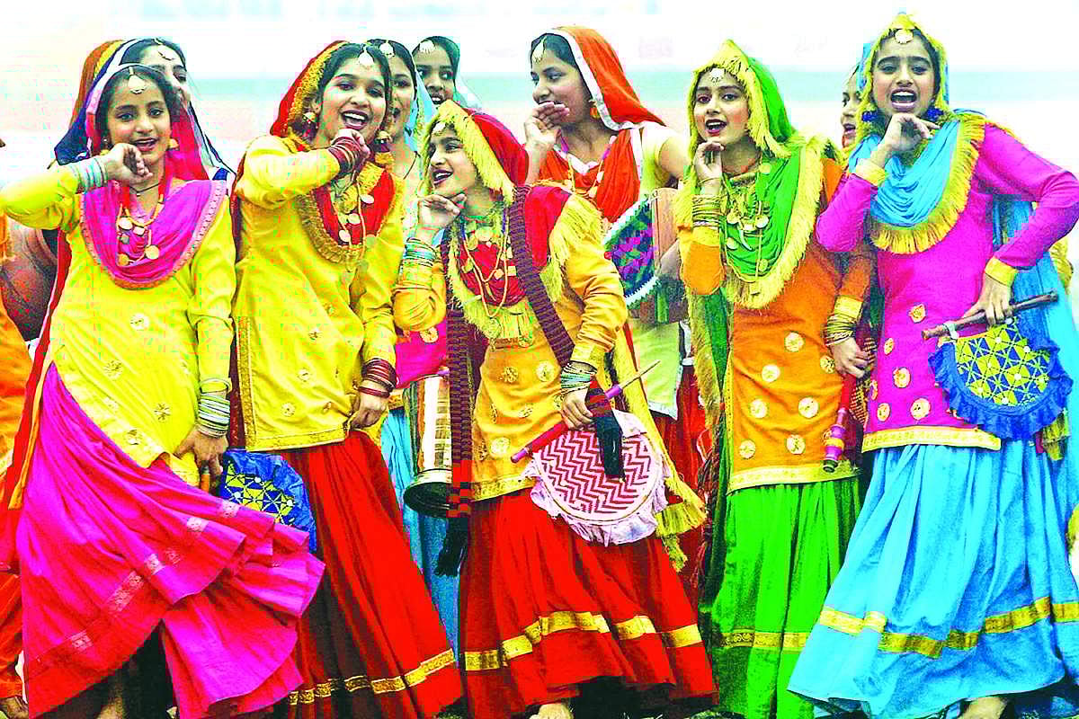 Schoolgirls perform a traditional Punjabi folk dance, the 'Giddha' during Republic Day celebrations at Guru Nanak Stadium in Amritsar on Monday.