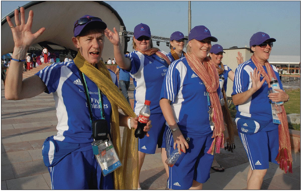Scotland contingent waving on their arrival at the Commonwealth Games village in New Delhi on Monday.