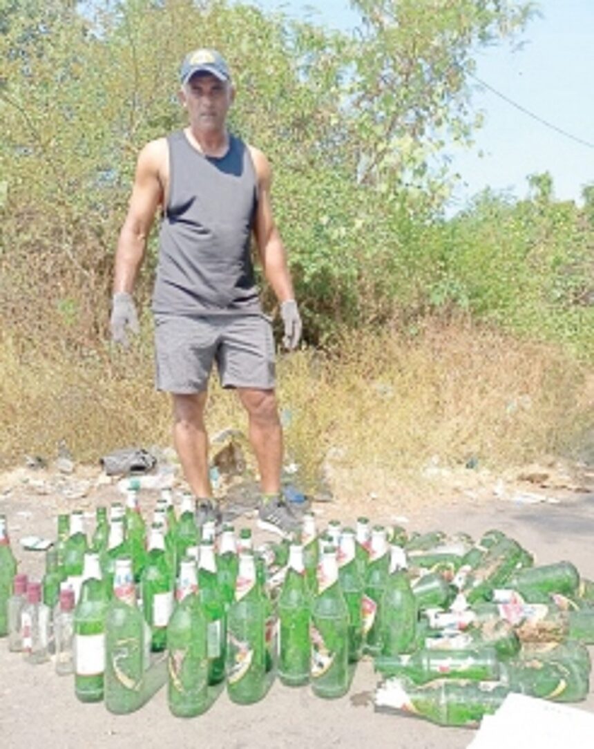 Social activist collects empty beer bottles, dumps them in front of municipal building