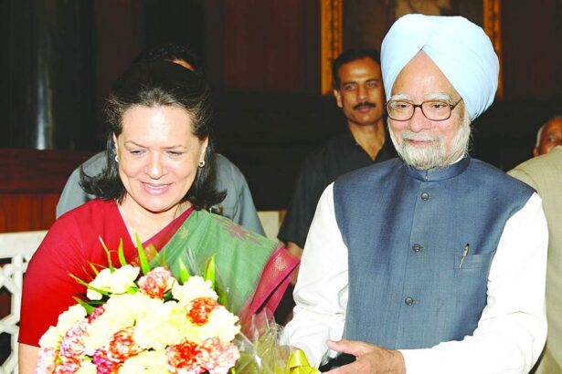Sonia Gandhi receives a bouquet from Manmohan Singh after he was elected leader of the CPP at Parliament House.