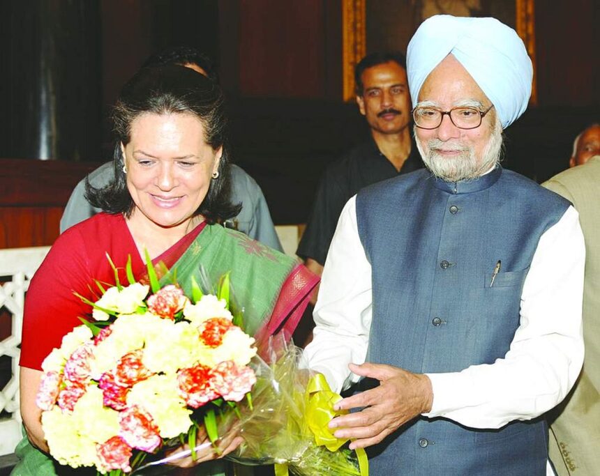 Sonia Gandhi receives a bouquet from Manmohan Singh after he was elected leader of the CPP at Parliament House.