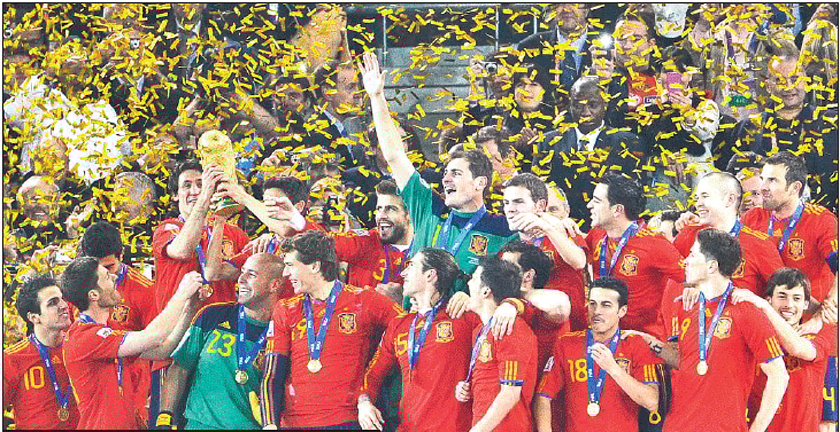 Spanish players celebrate with the trophy after their maiden World Cup win.
