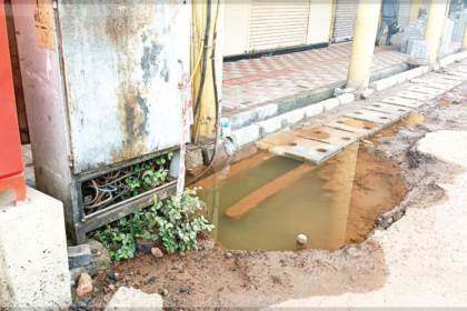 Stagnant Water Near Ferry Point Raises Health Concerns for Commuters and Shopkeepers