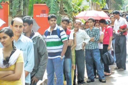 Students and parents wait in a queue outside the Education Department, Margao.