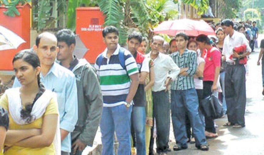 Students and parents wait in a queue outside the Education Department, Margao.