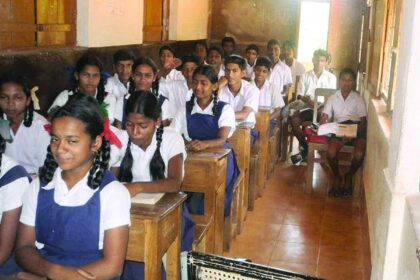 Students of Government Primary School, Kudchirem seen studying in the verandah of the school.                Photo by Vishant Vaze