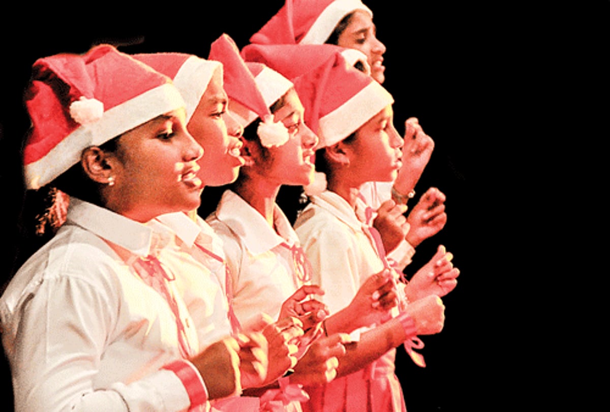 Students of St John of the Cross High School, Sanquelim, sing Christmas carols in different languages at the Christmas Fiesta 2013 organised by Diocesan Society of Education at Kala Academy in Panjim on Friday.