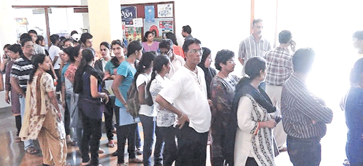 Students queue up outside the Chowgule HSS on Friday.