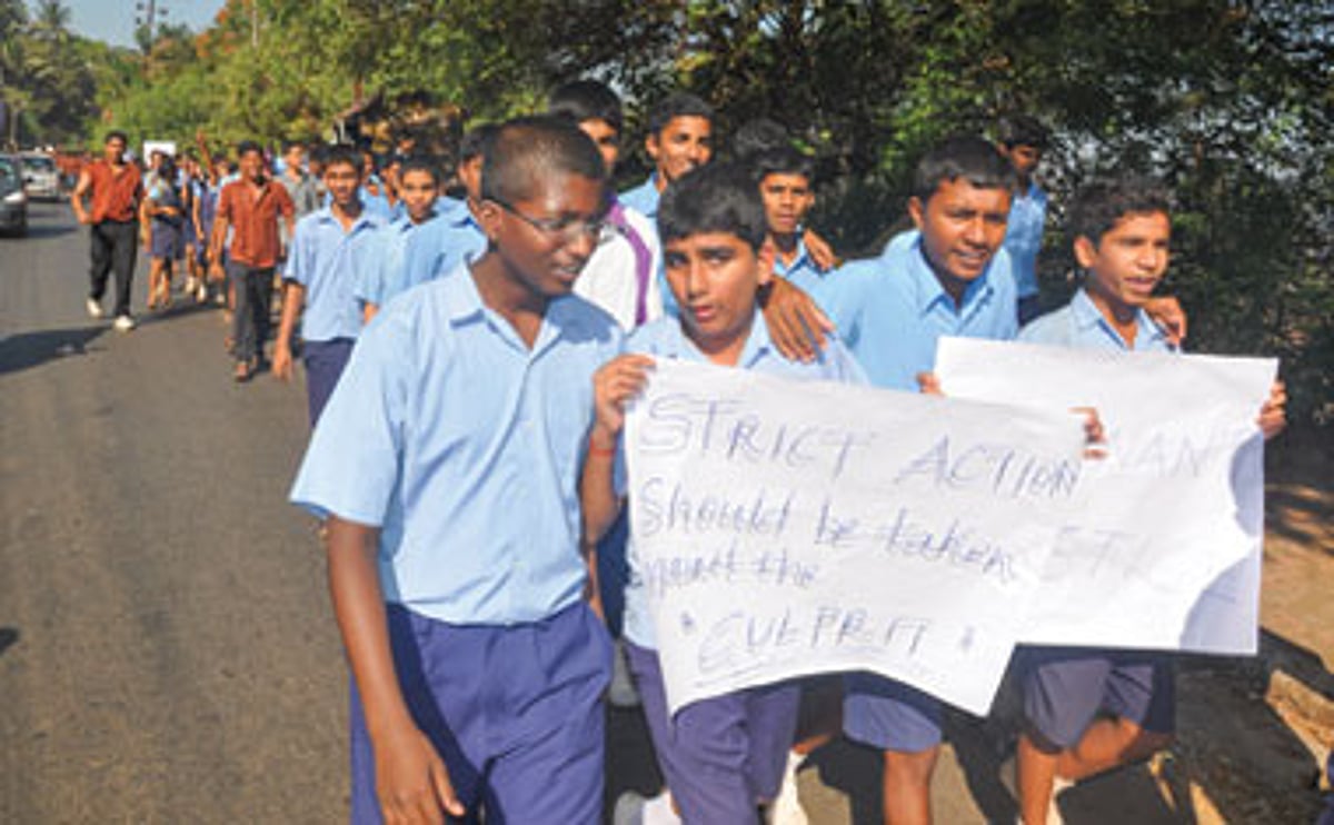 Students take part in a protest rally demanding the immediate arrest of the accused in Vasco.