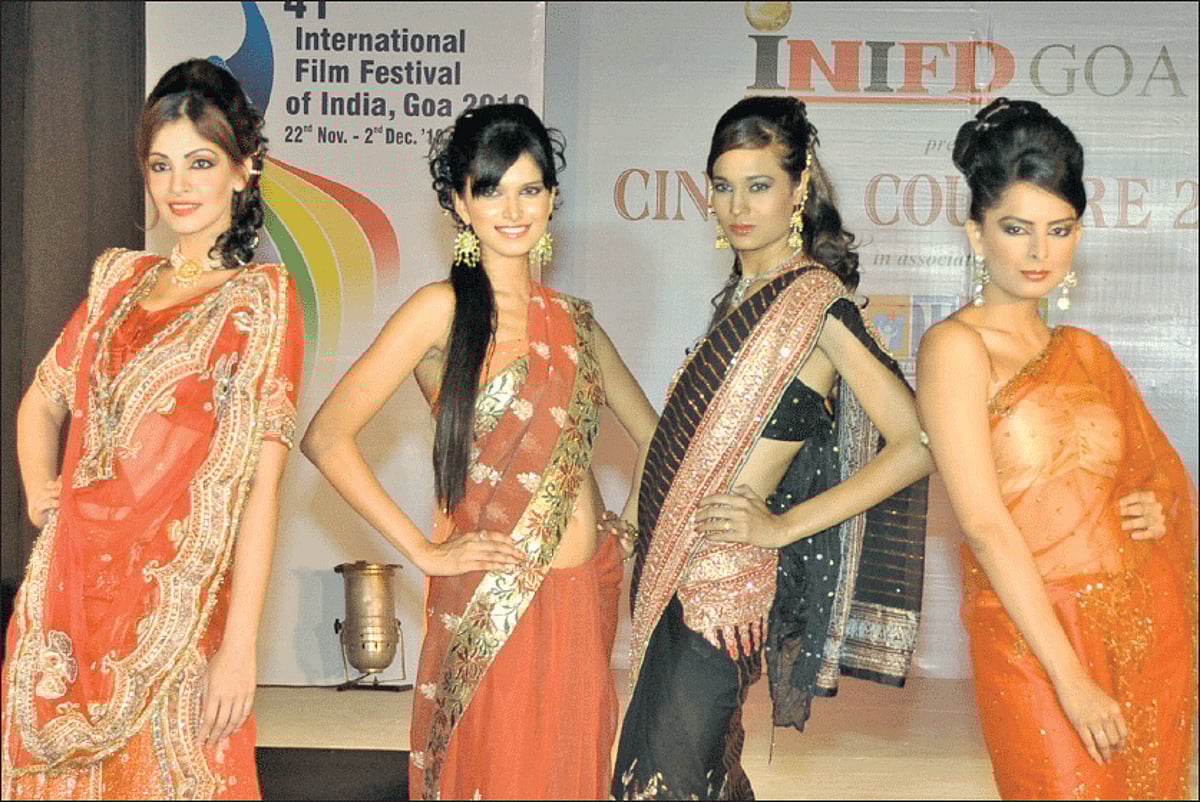 TAKING THE SILK ROUTE: Models display Indian silk sarees at the INIFD Goa fashion show presented by Cinema Couture 2010 in association with ESG in Panjim on Tuesday.