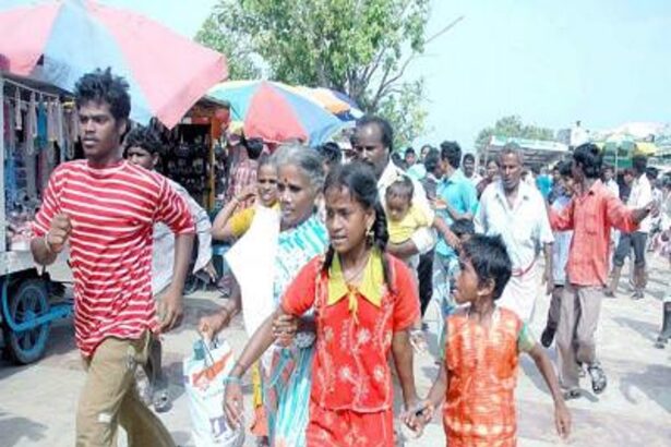 TSUNAMI FEAR: People rushing back from Marina Beach, in Chennai on Sunday after a strong earthquake in Sumatra in Indonesia.
