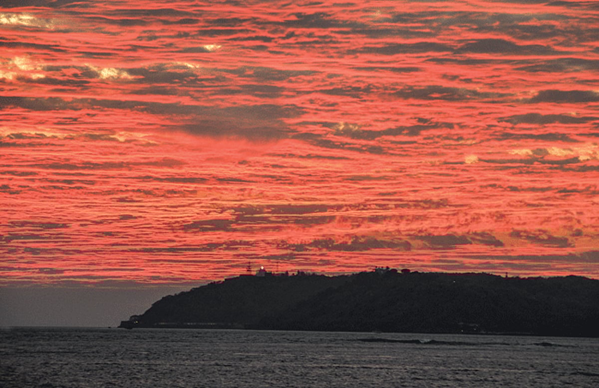 The Aguada lighthouse silhouetted against the blazing March sky as the sun sets on Saturday evening.