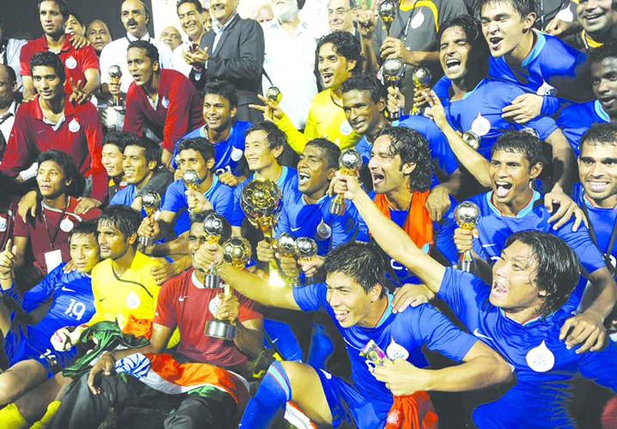 The Indian national football team players display their throphies in New Delhi on Monday.
