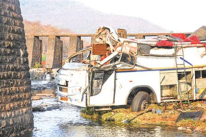 The bus with its roof top completely torn off.