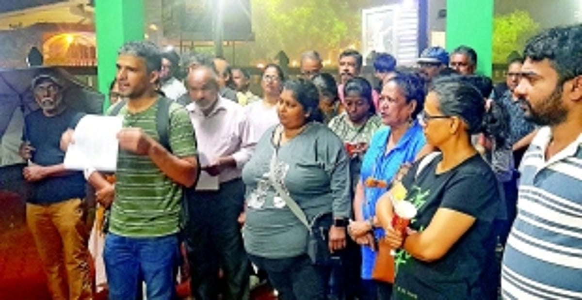 The candles of protest against music party pollution burn bright in the pouring rain