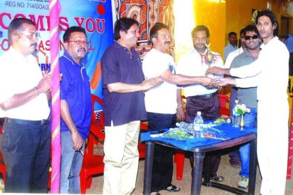 The captain of Stamina Boys, winners of 4th all-Goa season ball T20 cricket tournament organised by Manorva Sports and Cultural Club, receiving the trophy from Dayanand Narvekar at Chapora on Monday. Dayanand Mandrekar, MLA is also seen.