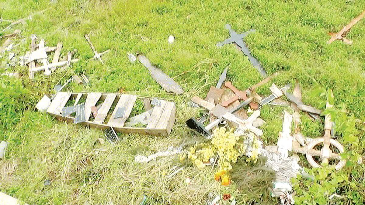 The crosses and other items from the cemetery of St Rock Church, Tolleacanto are seen thrown outside