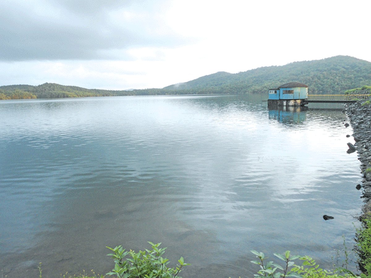 The reservoir of the Chapoli dam is full to capacity and overflowing from its exit point.