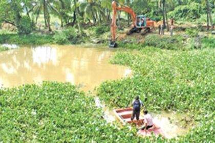 The river Sal being cleared of water hyacinth by the Water Resources Department
