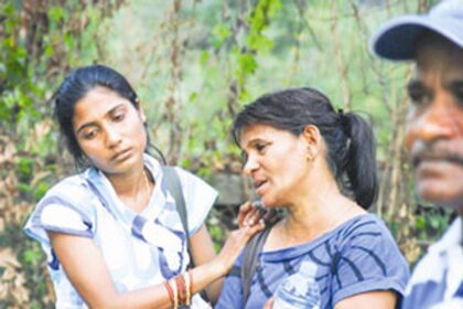 This woman at the accident site cries inconsolably over the loss of her dear one.