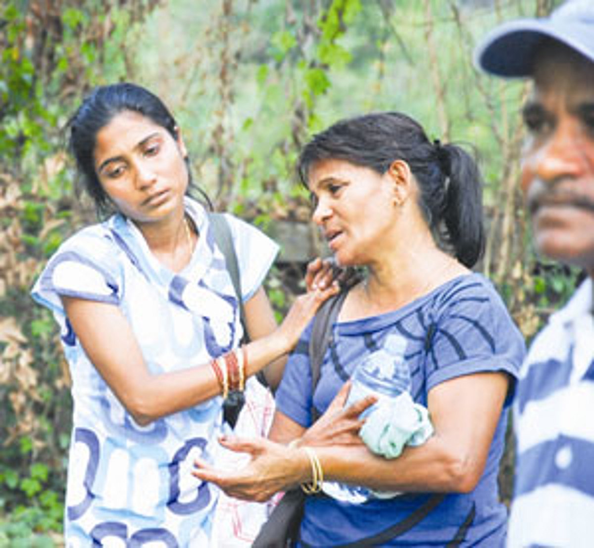 This woman at the accident site cries inconsolably over the loss of her dear one.