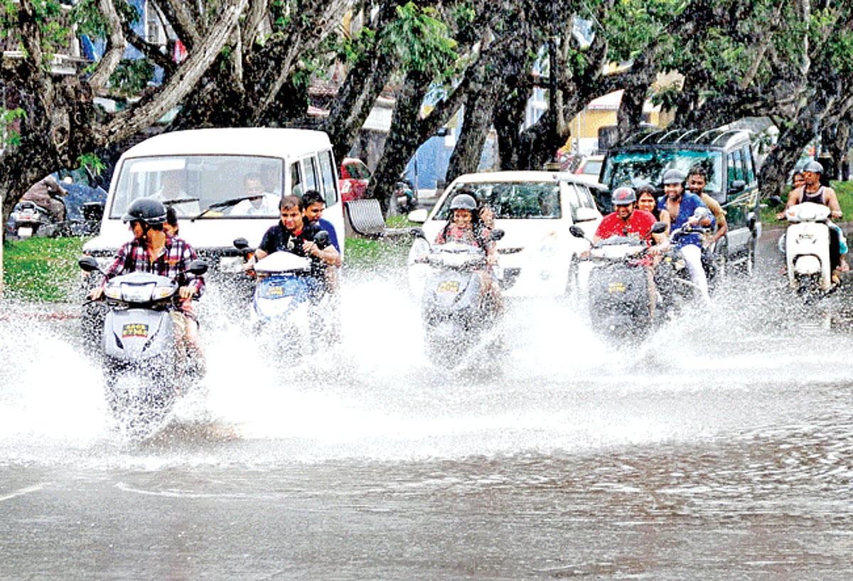 Tourists enjoy their ride on the flooded road opposite the Captain of Ports jetty in Panjim on Monday.