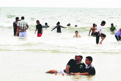 Tourists make merry at the Colva beach.