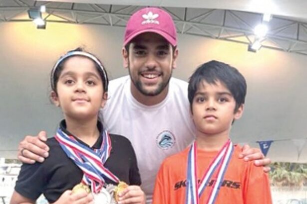 Twins Rachel, Troy shine at Dubai swimming