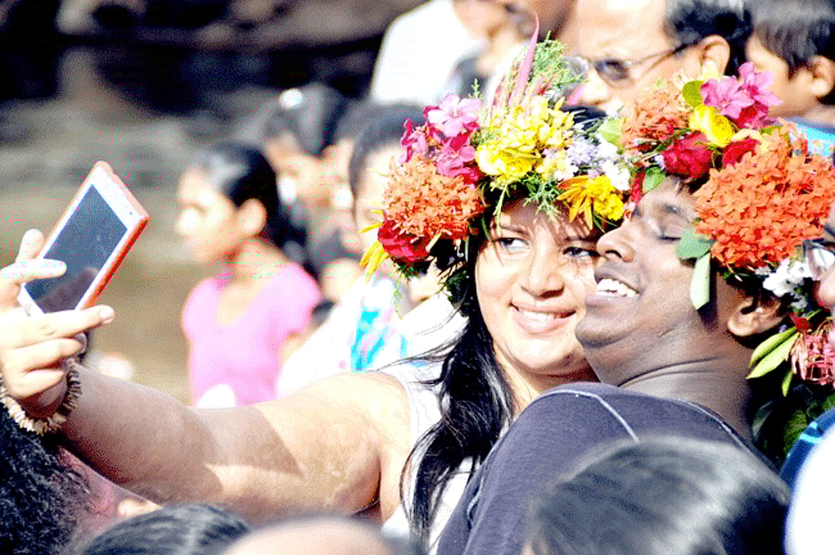 VIVA SAO JOAO: A couple captures a selfie wearing colourful kopels on the occasion of Sao Joao in Siolim on Tuesday. Despite the rains giving Goans a miss, the festival was celebrated with traditional gusto across the State.