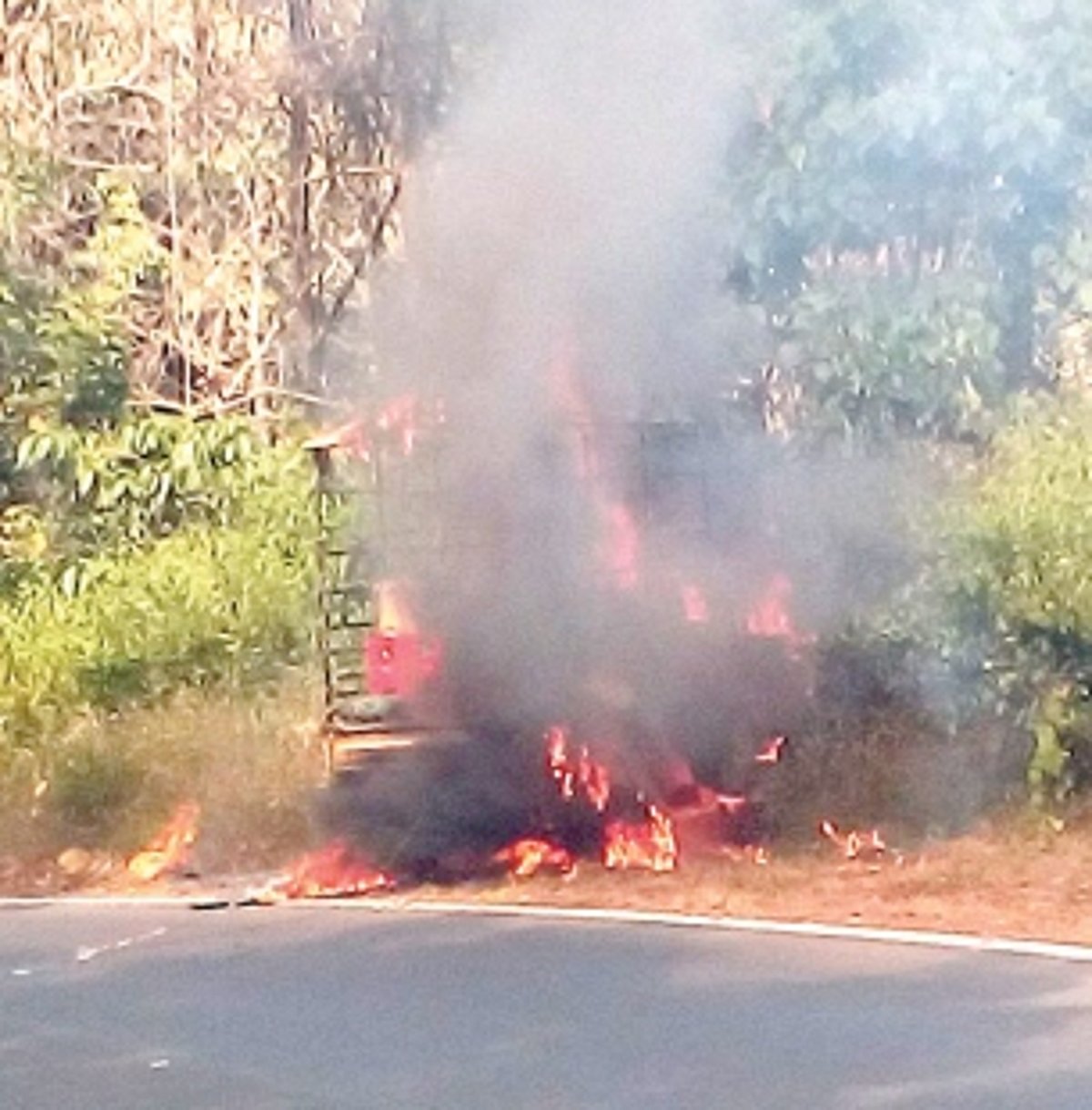 Vehicle catches fire after hitting a signboard at Karmalghat
