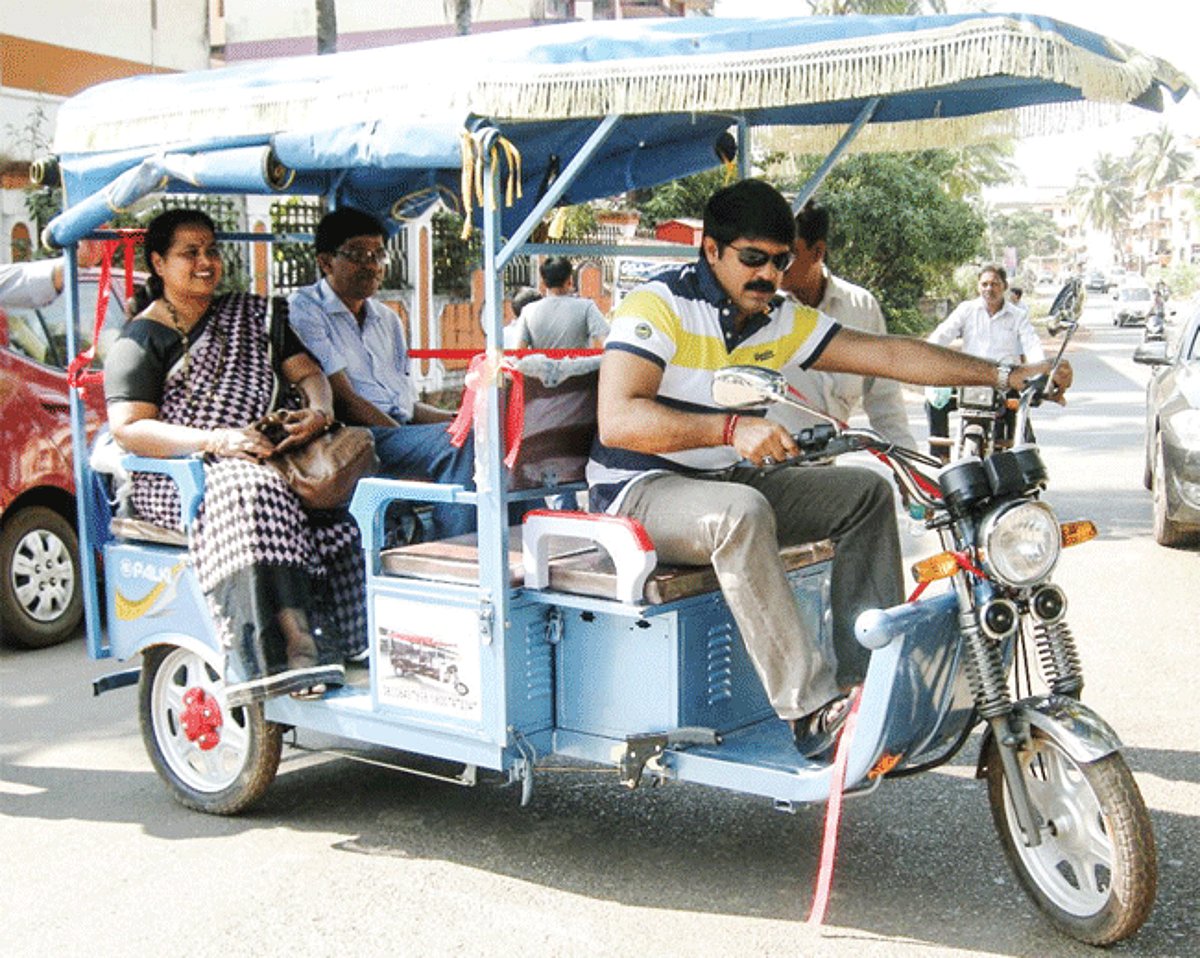 Vijai Sardesai driving the eco-friendly rickshaw.