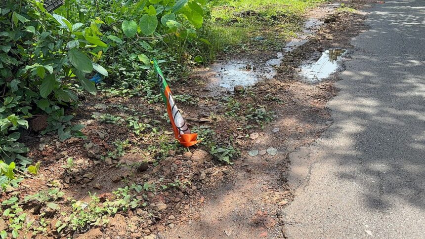 Villagers Plant BJP Flags in Potholes to Protest Dangerous Tilamol–Kevona Road 1 Villagers Plant BJP Flags in Potholes to Protest Dangerous Tilamol–Kevona Road