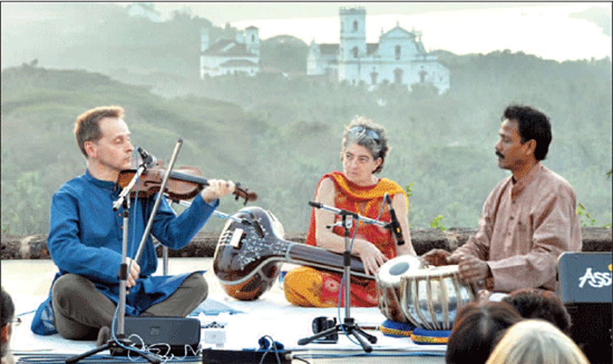 Violinist Stephen Bull from Portugal plays music from 18th century India and Europe accompanied on tabla by Tarun Chattopadyay and Angela Jones on tanpura at The Monte Music Festival 2012 at Old Goa.
