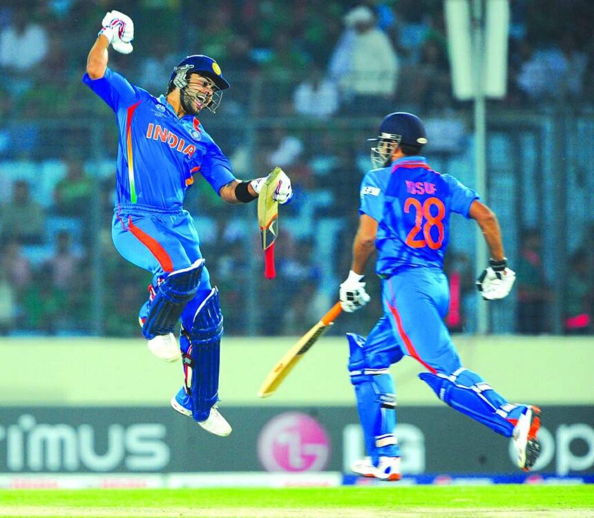 Virat Kohli reacts after scoring a century during the first match of the World Cup cricket tournament between Bangladesh and India. Man-of-match Virender Sehwag scored 175.