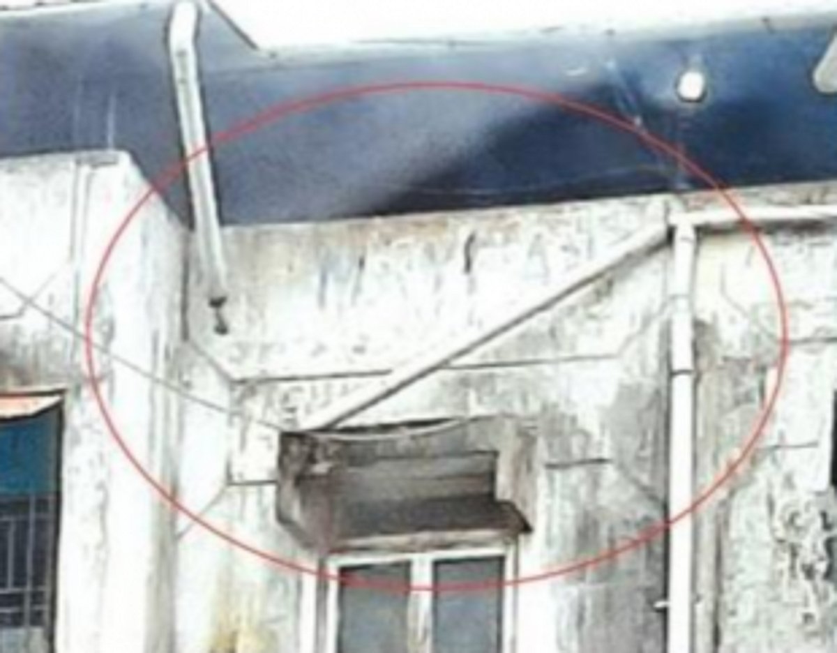 Water pipe hanging dangerously  from a building at Margao